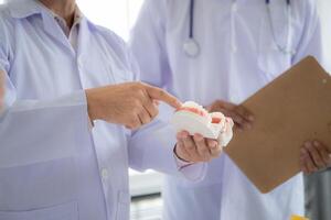 A medical professor is lecturing on a case study related to oral and dental treatment to medical students photo