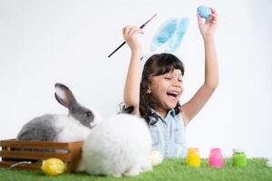 Easter bunny fun with little children the beauty of friendship between humans and animals photo