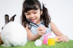 Easter bunny fun with little children the beauty of friendship between humans and animals photo