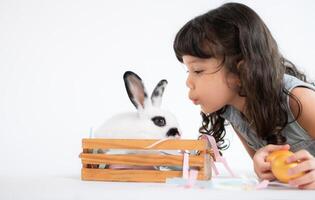 Easter bunny fun with little children the beauty of friendship between humans and animals photo