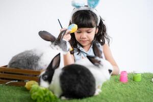 Easter bunny fun with little children the beauty of friendship between humans and animals photo