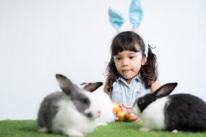 Easter bunny fun with little children the beauty of friendship between humans and animals photo