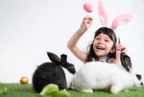 Easter bunny fun with little children the beauty of friendship between humans and animals photo