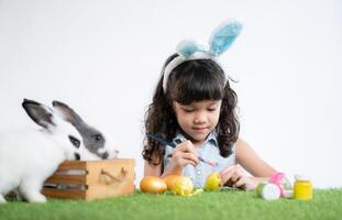 Easter bunny fun with little children the beauty of friendship between humans and animals photo