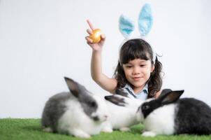 Easter bunny fun with little children the beauty of friendship between humans and animals photo