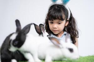 Easter bunny fun with little children the beauty of friendship between humans and animals photo