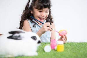 Easter bunny fun with little children the beauty of friendship between humans and animals photo