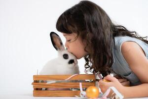 Easter bunny fun with little children the beauty of friendship between humans and animals photo