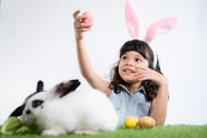 Easter bunny fun with little children the beauty of friendship between humans and animals photo