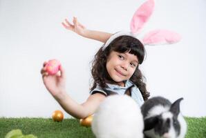 Easter bunny fun with little children the beauty of friendship between humans and animals photo