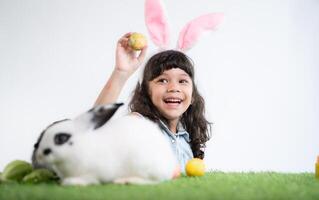 Easter bunny fun with little children the beauty of friendship between humans and animals photo