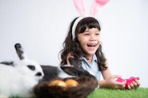 Easter bunny fun with little children the beauty of friendship between humans and animals photo