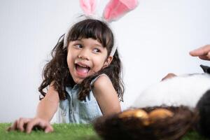 Easter bunny fun with little children the beauty of friendship between humans and animals photo