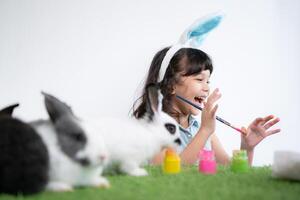 Easter bunny fun with little children the beauty of friendship between humans and animals photo