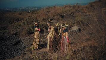 Group of hikers trekking on a rugged mountain trail with panoramic views in the background. video