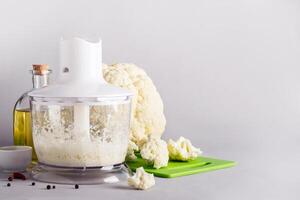 Cooking cauliflower rice in a blender, copy space photo