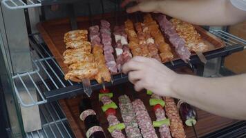 A tray of kebabs with meat and veggies a delicious dish on the table video