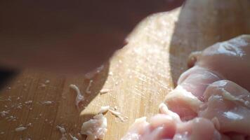 cutting chicken fillet on a chopping board video