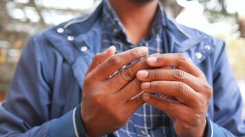 man suffering pain in hand close up video