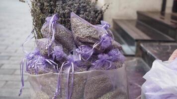 A stack of purple lavender bags fills the basket, creating a beautiful pattern video