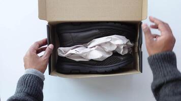 Set with stylish shoes and cardboard boxes on color background. video