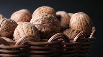 Wicker basket filling by walnuts video