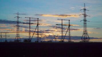 Time lapse of clouds over high voltage power line. Beautiful evening scenery. video