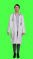 Front view General practitioner welcoming patients and inviting them to come closer, greeting sick persons at checkup exam appointments. Doctor waving at people and asking them to approach her. Camera A. video