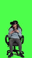 Front view Woman feeling furious and disappointed with losing mobile gaming competition, playing tournament with smartphone and virtual reality headset. Displeased gamer sad after lost game. Camera A. video