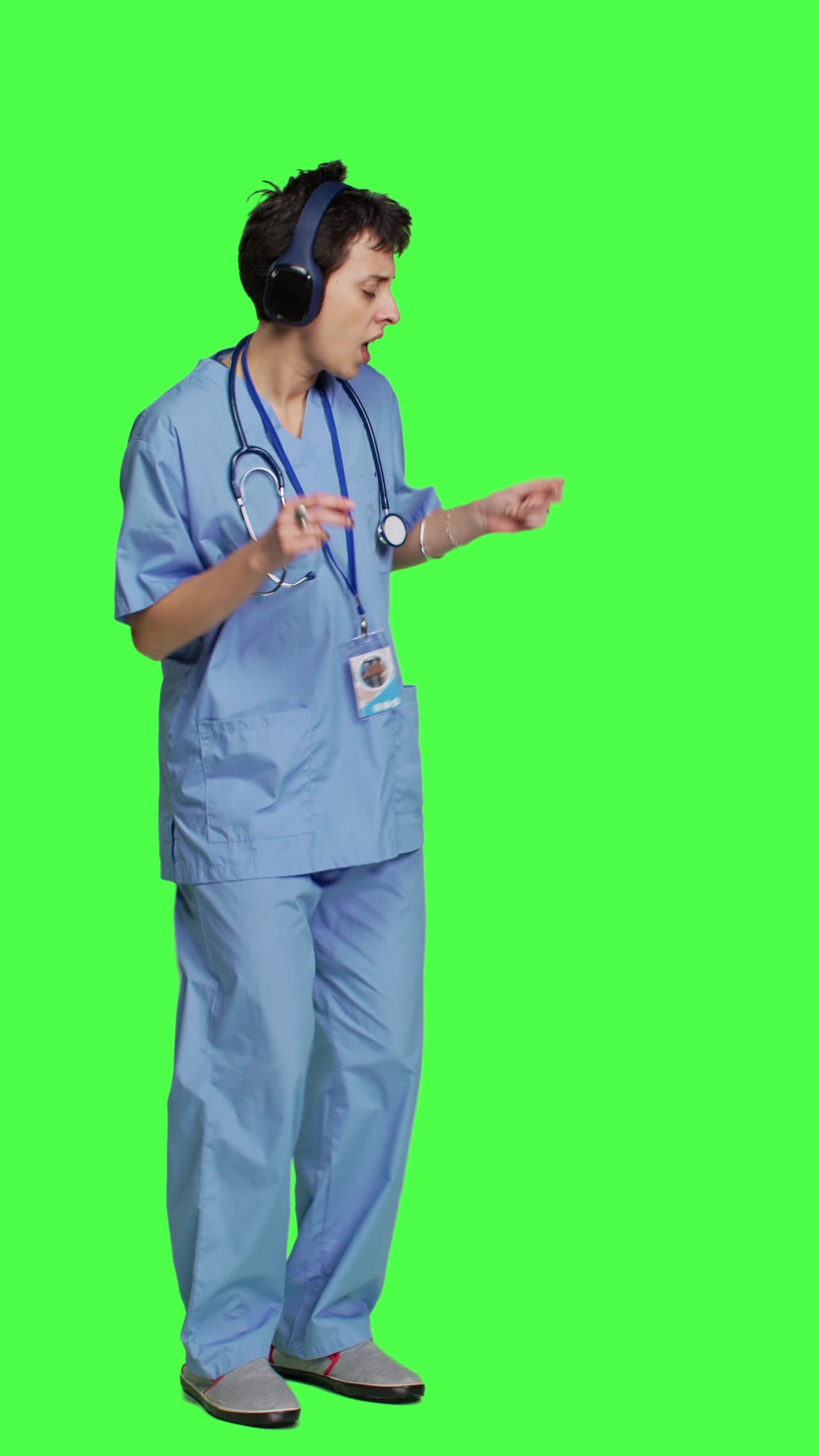 Side view Nurse having fun listening to music on wireless headphones