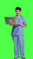 Front view Nurse attending online telemedicine videocall on laptop, talking to patients about disease diagnosis and treatments. Specialist consulting people on internet conference network. Camera A. video