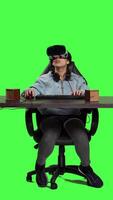 Front view POV of gamer using virtual reality on pc video games and winning, feeling proud and happy with her championship victory. Woman with vr headset at desk playing shooter contest. Camera A.