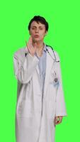 Front view General practitioner showing hush symbol to be quiet and keep secrecy, putting finger over lips for privacy and silence expression. Medic doing mute symbol, asking to be quiet. Camera B. video