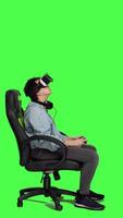 Profile Sad woman losing video games e sport tournament with vr glasses, playing online competition using controller and 3d virtual reality interactive headset against greenscreen. Angry gamer. Camera A.