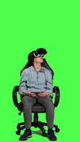 Front view Female player uses virtual reality headset to play with friends online on internet connection, has fun with gaming competition. Gamer playing in tournament with vr interactive glasses. Camera A. video