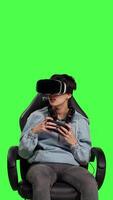 Front view Woman feeling furious and disappointed with losing mobile gaming competition, playing tournament with smartphone and virtual reality headset. Displeased gamer sad after lost game. Camera B. video