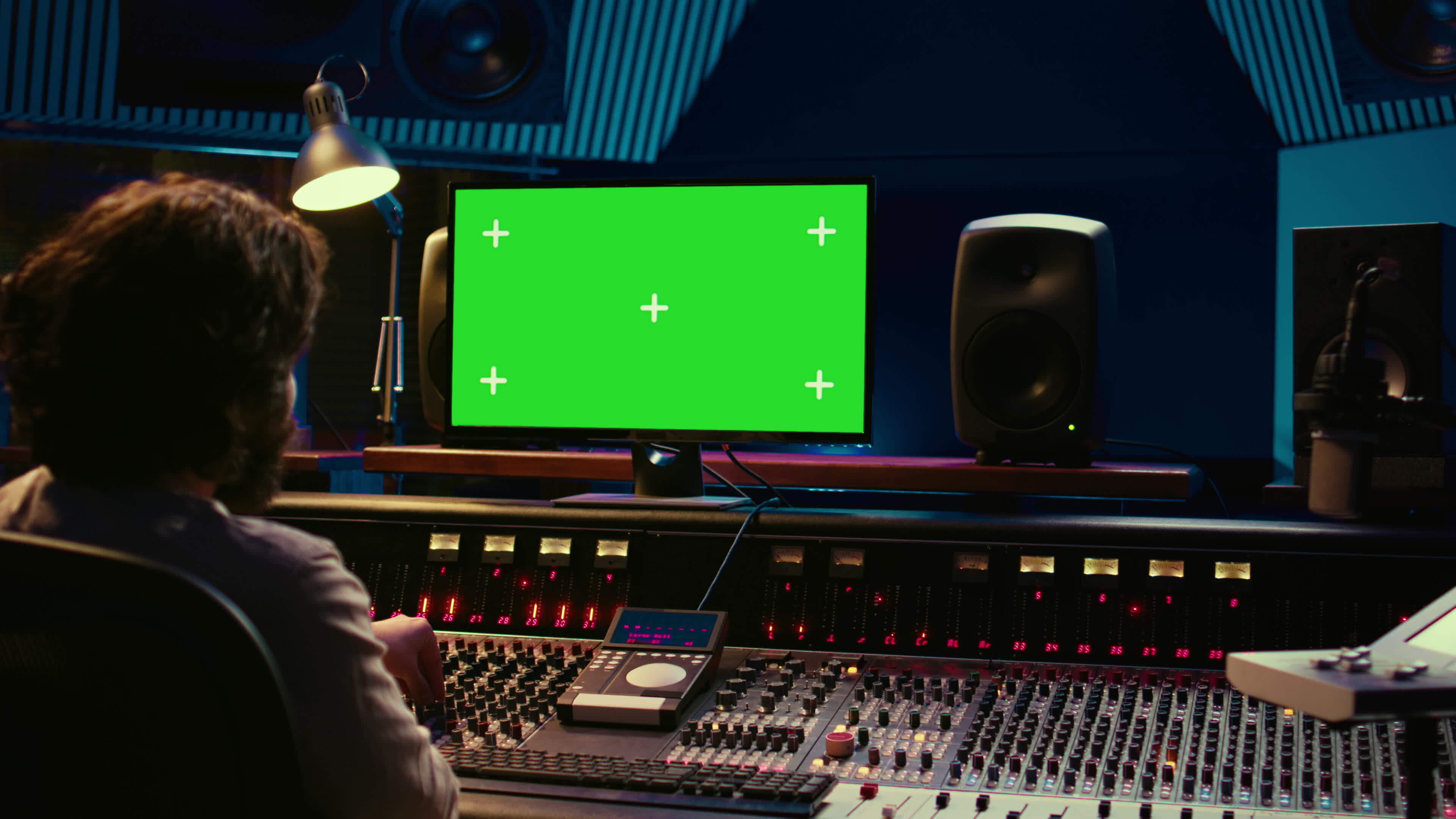 Sound technician learns to mix and master tracks by watching tutorials on greenscreen pc
