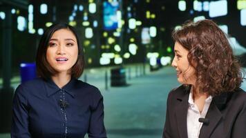 Journalists team on late night talk show presenting news on international broadcast channel, media advertisement. Two diverse women hosting new network program for daily news and events. photo