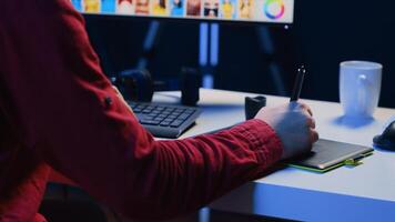 Photographer using graphic tablet to perform editing operations to correct images in creative agency. Photo editor using stylus on touchscreen device to make adjustments to photographs, close up