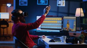Photo editor using high tech VR goggles to look at editorial pictures taken with professional camera for fashion magazine. Freelancer browsing images using virtual reality headset technology
