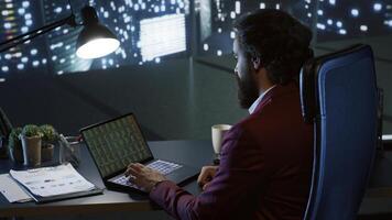 Research experts studies economic activity and searches for notable developments in worldwide stock trade. Businessman shareholder enjoys downtown skyscraper view after hours. photo