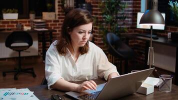 Worker creating marketing project plan on laptop, writing necessary steps, close up shot. Zoom in on office clerk working on strategy research to create financial development for company photo