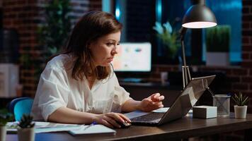 Office clerk wincing at laptop screen, unable to believe disappointing negative response received from client while discussing business matters. Worker doing upset face grimace, feeling annoyed photo