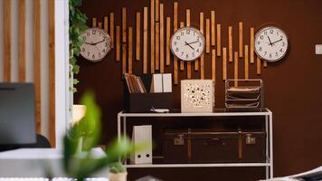 Empty front desk and lobby at luxurious vacation resort with clocks showing different international time zones. Modern reception and lounge area ready for guests and travelers, hospitality industry. photo