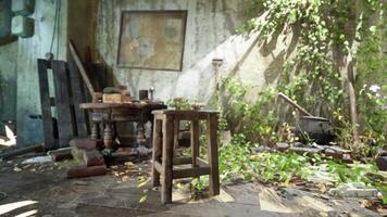 An abandoned room with a chair and table in a state of devastation video