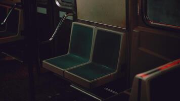 A green seat in a metro train or bus video