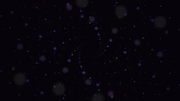 Abstract animation of twisting spiral of dots. Swirling spiral of colored muddy dots on black like starry outer space photo