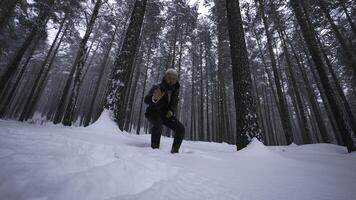 Man raps in winter forest. Media. Stylish man moves in hip hop style in winter forest. Man reads hip hop in winter forest photo