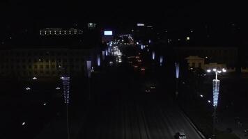 Top view of modern night city with cars and lanterns. Stock footage. Night city highway with moving cars and glowing lanterns. Beautiful night city with cars and garlands on lanterns photo