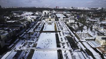 Top view of large square with historical architecture in winter. Creative. Historic square with alleys and Soviet architecture in city center. Winter landscape with Soviet architecture on background photo